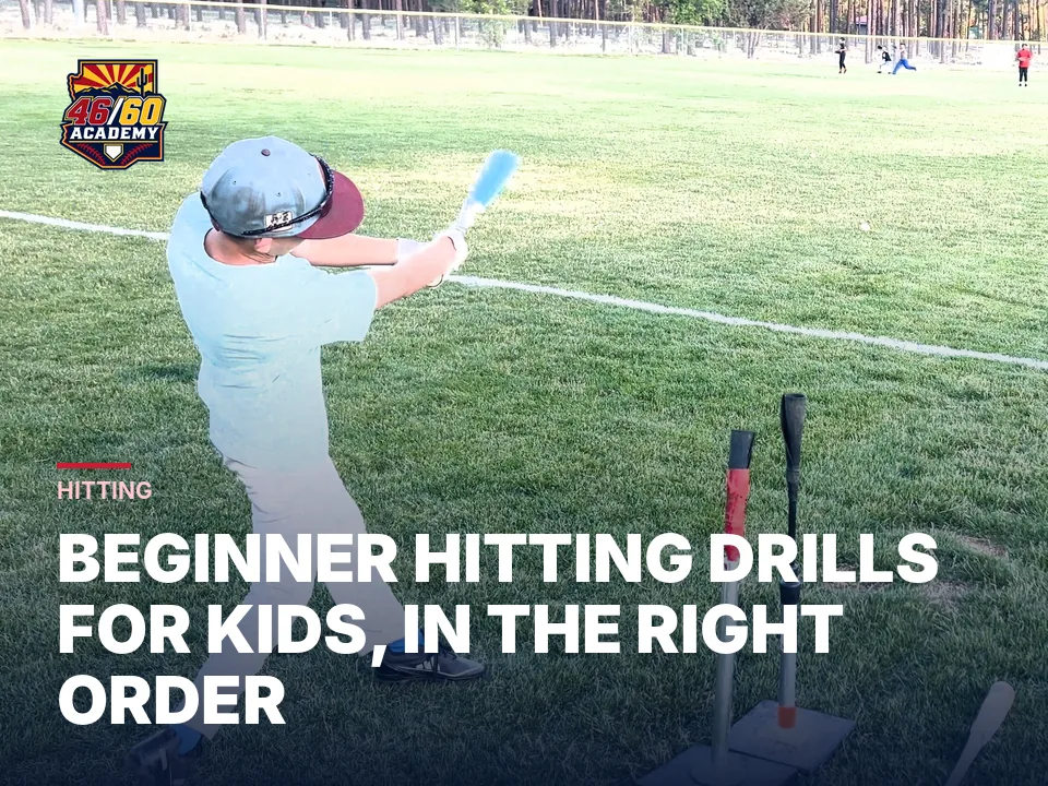 Young hitter swinging through contact at a tee station during a 46/60 camp