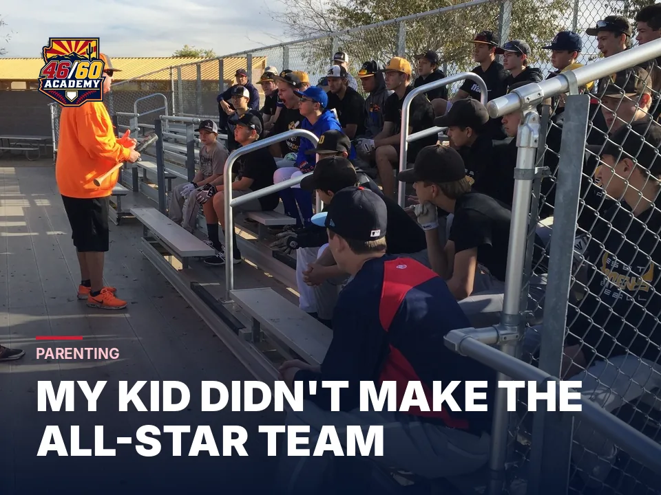 Coach talking with young players sitting in the bleachers