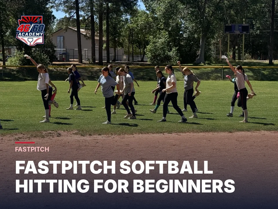 Young fastpitch players doing dynamic warm-ups at a camp