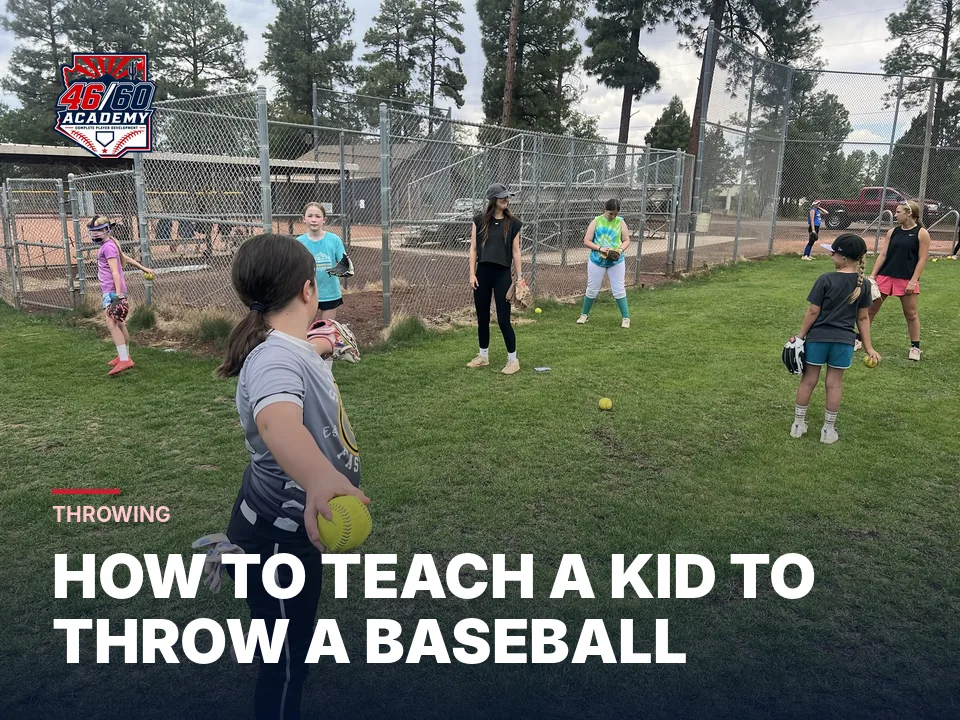 Young softball player working on her throwing at a camp