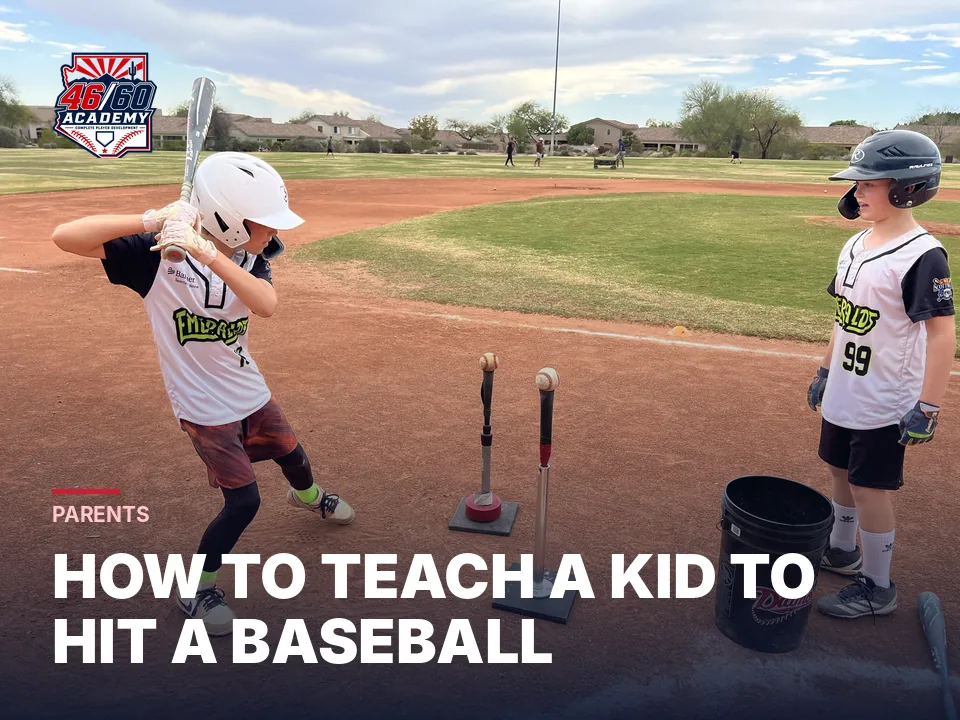 Two young hitters working at a tee station at a 46/60 camp